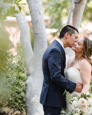 Beautiful couple and a kiss on the cheek