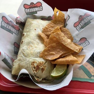 Fish burrito and fresh chips.