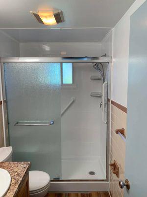 tub to shower conversion with 12x24 white tile for shower surround