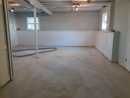 This is the before - bare concrete basement floor