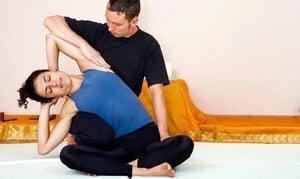 Thai massage position stretching on the side.