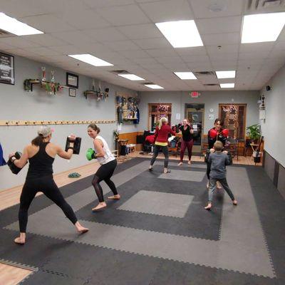 UJJ Adult Kickboxing Class practicing striking and movement.