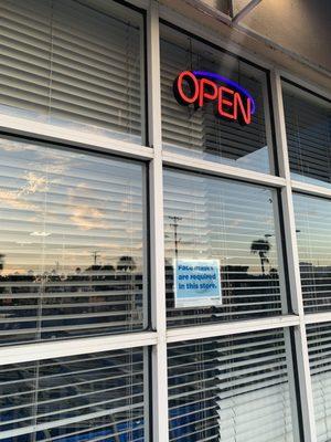 Open sign lit up but store is not open