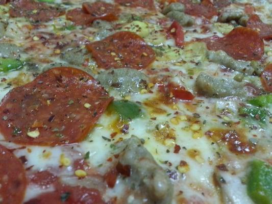 up close and personal with an almost 18" supreme pie for $9.99 on Tuesdays.  (pick any pie)