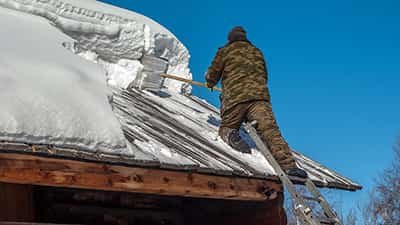 Clearing Snow from a Roof