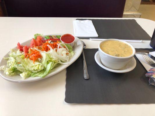 Salad with French dressing. Cup of broccoli cheese soup.