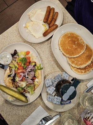 Pancakes, eggs and sausage - $21.45  Chicken gyro on pita - $12.95  July 2024