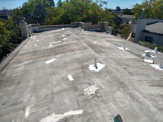 Before roof coating w/ spot treatments