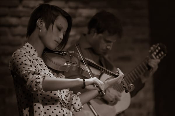 Performing with violinist, Chihsuan Yang