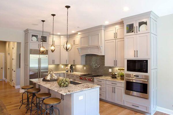 Grey Shaker cabinetry with quartz countertops. Uppers have stacked cabinetry