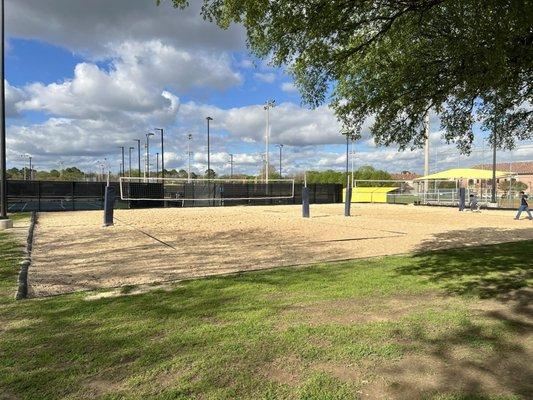 Volleyball and tennis courts located on the backside