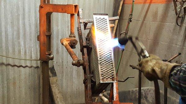 Running the headers on a radiator with a bell torch.