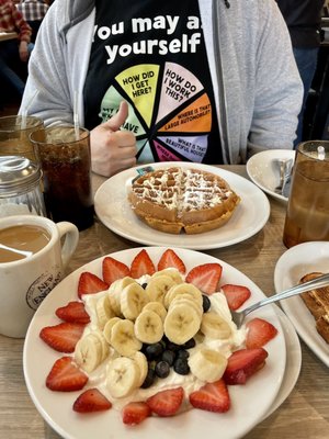 Greek yogurt with "red white and blue" fruit, amazing coffee, and the carrot cake Belgian waffle special