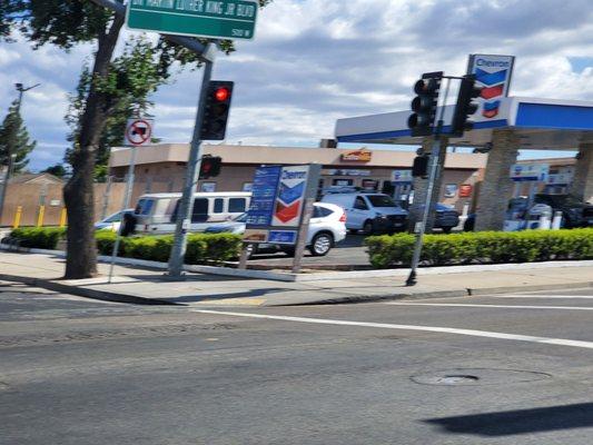 Chevron at the corner of Lincoln and Charter Way/Dr. MLK Blvd. And bamner advertising L. Soda for $0.49 at entrance.