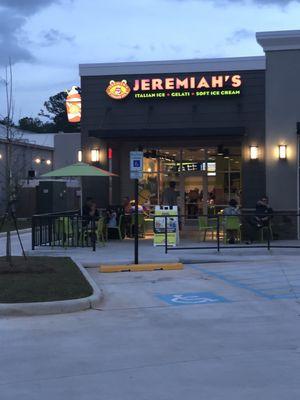 Outside the store. There is outside seating and inside seating. There is also a drive thru.