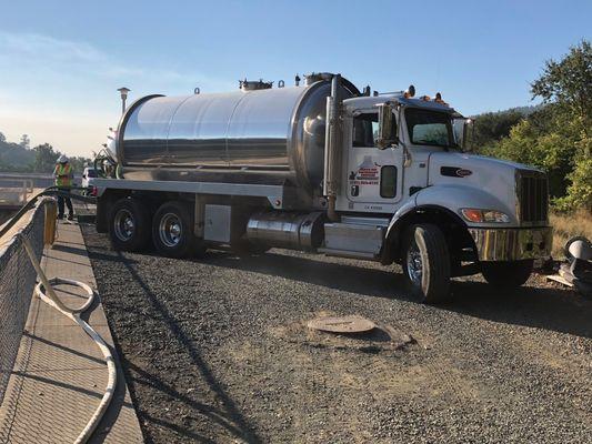 Our interceptor pumping truck is so powerful that we were hired by a municipality to pump the contents of a wastewater treatment pit.