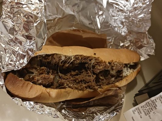 The best cheese steak you'll ever eat gooey hot fresh fried onions Mayo on the roll and a little black pepper