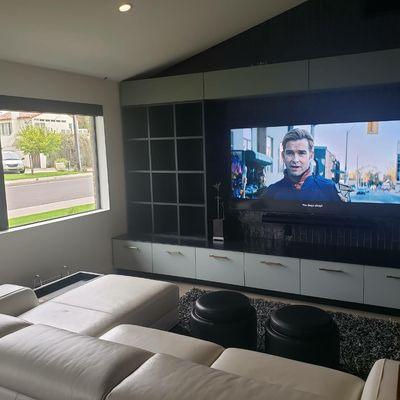 82" TV with a Sonos Arc. Even a Lutron roller shade.