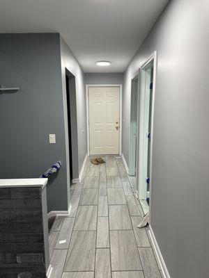 Painted ceilings, walls, and trim in the garage entry.