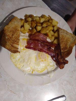 Lots of breakfast with homemade toast and yummy home fries!