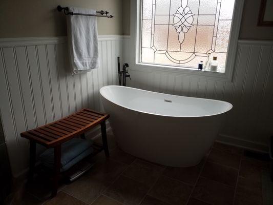 New tub, flooring, and wainscoting.