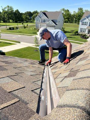 Chalking up gutters during a storm damage inspection