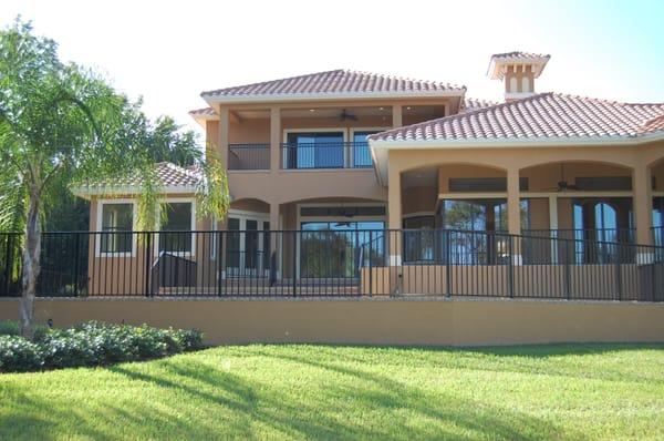 Aluminum fence and custom railing overlooking Lake