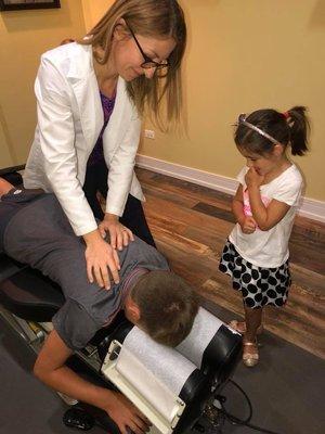 picture of my son being adjusted.  My daughter patiently awaiting her turn!