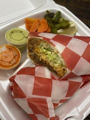 Burrito normally comes with choice of meat, rice, cheese, lettuce, cilantro, onions and sour cream