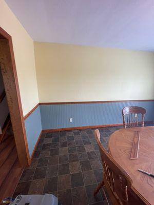 Ceiling, walls, trim, chair rail, wainscoting. Custom yellow and green walls picked by customer. Wood trim wainscoting installed.