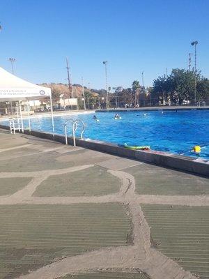 a lovely neighborhood pool with decrepit changing rooms