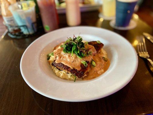 Blackened grouper on a bed of cheese grits.