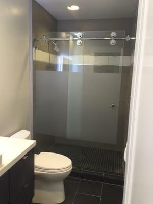 Hallway bathroom sliding door with sandblasted glass