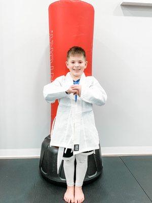 New Student Alert 
Let's welcome our newest Pre-Teen student, Ben 

He was thrilled to earn his uniform today!