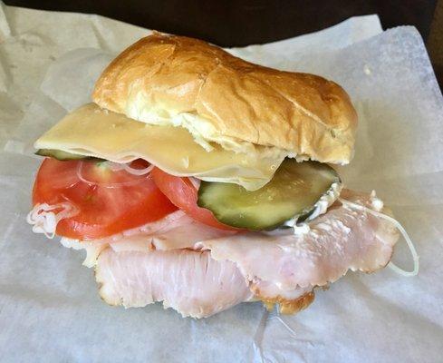 Turkey sandwich on fresh roll with everything