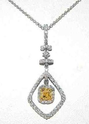 18KT WHITE GOLD PENDANT 0.52 CARAT  YELLOW DIAMOND ACCENTED WITH 0.51CTTW OF 65 ROUND WHITE DIAMONDS TOTAL WEIGHT: 4.05 GRAMS.