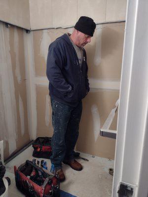 Plumber contemplating next steps.