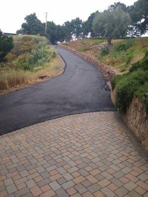 Partial look at of our repaired and re-paved road.  Brilliant work by Saviano and team!