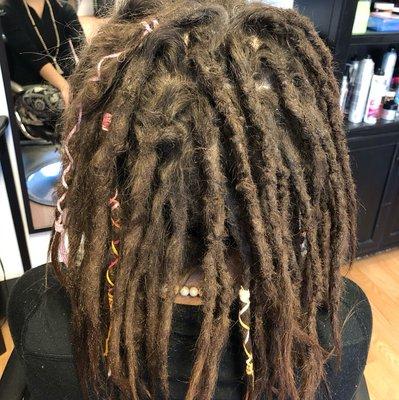 Half finished dreadlocks maintenance. A great visual of the difference a maintenance appointment can make. Boise dreadlocks