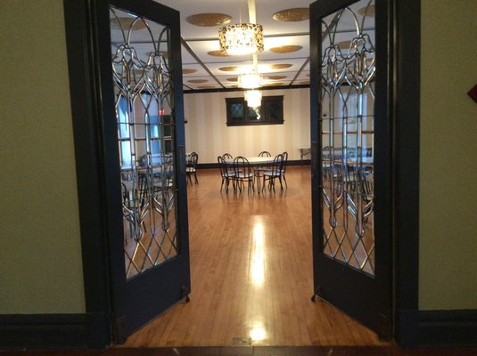 Leaded glass doors leading to the ballroom.