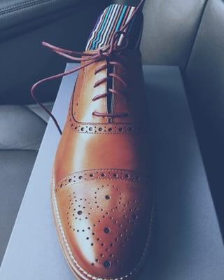 Conrad Cap Toe. Very versatile shoe that compliments both a pair of dress slacks (suit) and jeans.  Socks are navy base stripe