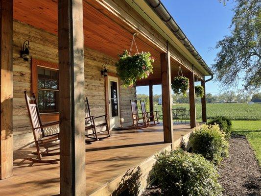 Front porch with rocking chairs.