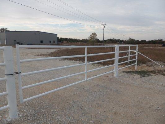 5 pipe fence after it was sandblasted and painted white