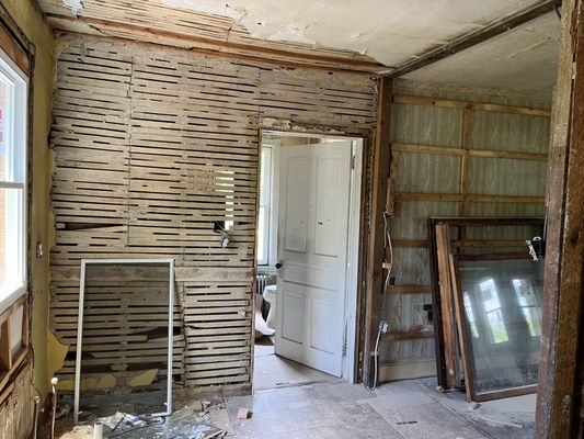 100 year old home opened up to create a modern eat-in kitchen.  Old lath walls drywalled, and complete with custom  kitchen cabinets.