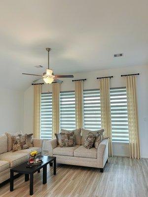 Decorative drapes and zebra shades