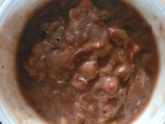 There are huge pieces of meat in the beans