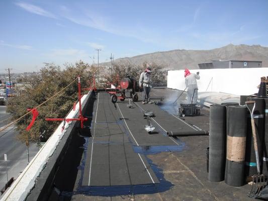 This photo shows our guys laying the new roof down.