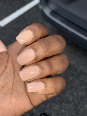 "Fill in with gel polish" cuticles and excess polish not cleaned, nail shapes not uniform.