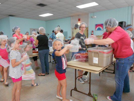 Packing food for Stop Hunger Now