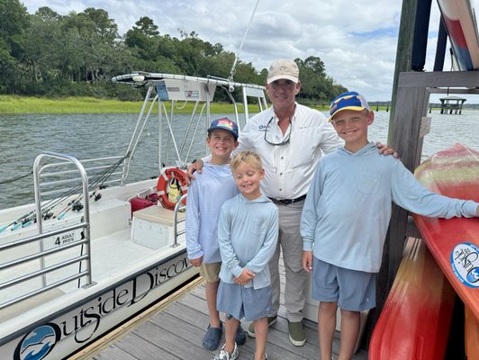 Captain Gio with 3 happy boys after a day on the water fishing